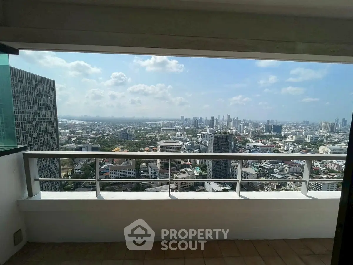 Stunning cityscape view from a high-rise balcony, perfect for urban living.