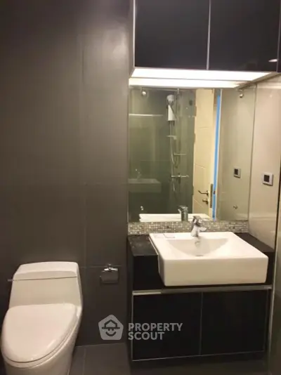 Modern bathroom with sleek design and elegant fixtures in a contemporary apartment.
