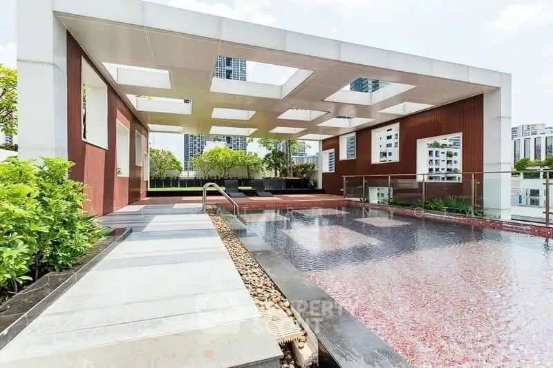Luxurious rooftop pool with modern design and city views, perfect for relaxation and entertainment.