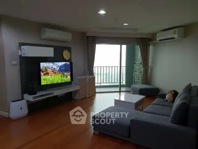 Spacious living room with modern furniture and balcony view