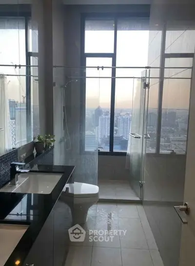 Luxurious bathroom with stunning city view and modern fixtures
