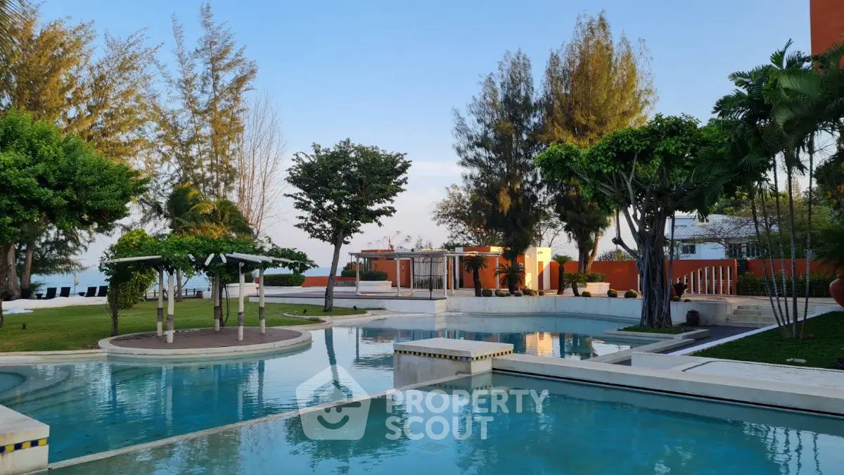 Luxurious outdoor pool area with lush greenery and modern design, perfect for relaxation and leisure.