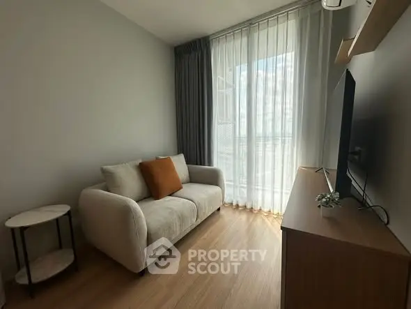 Cozy modern living room with natural light and stylish decor