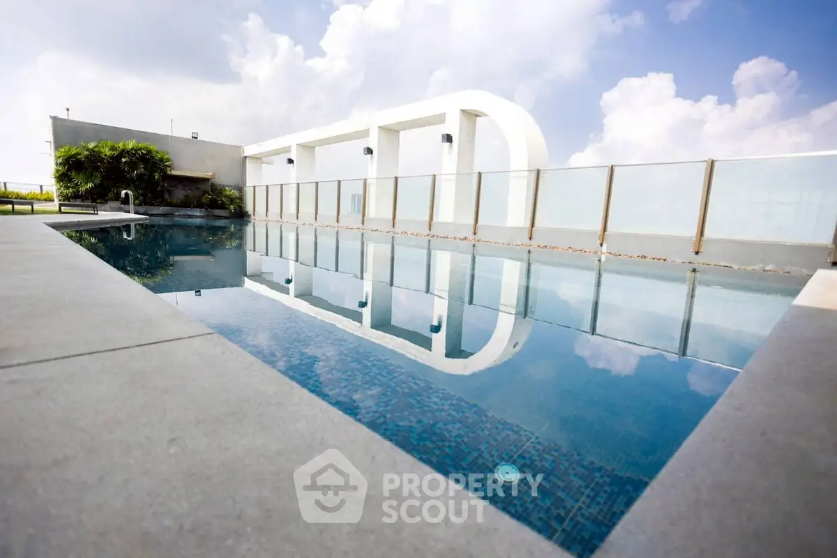 Luxurious rooftop pool with modern design and stunning sky view