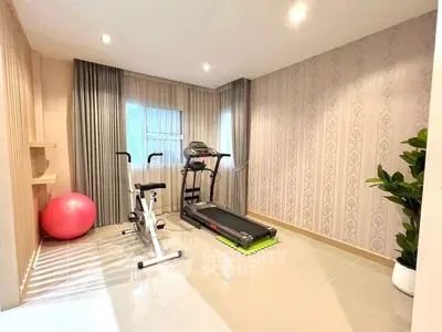 Home gym with treadmill and exercise bike in modern interior