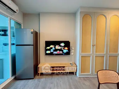 Modern living room with sleek fridge and stylish TV setup