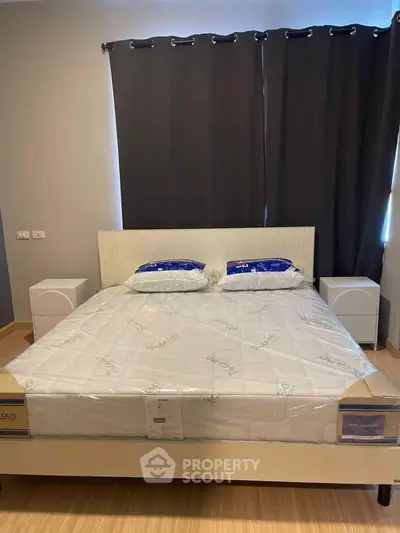 Modern bedroom with stylish bed and dark curtains, perfect for restful nights.