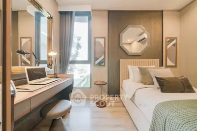 Modern bedroom with stylish decor and workspace, featuring large windows and elegant furnishings.