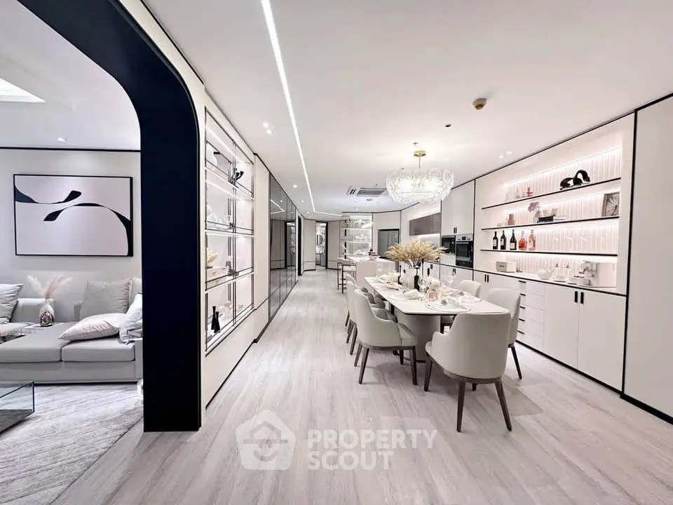 Luxurious open-plan living and dining area with elegant decor and modern furnishings.