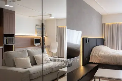 Modern studio apartment with cozy living area and stylish bedroom