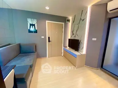 Modern living room with stylish decor and sleek furniture in a contemporary apartment.