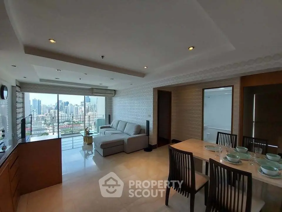 Spacious living room with city view and dining area in modern apartment