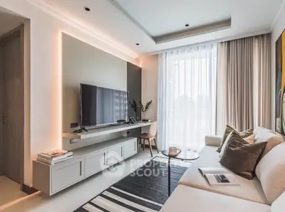 Modern living room with sleek design, large TV, and natural light from floor-to-ceiling windows.