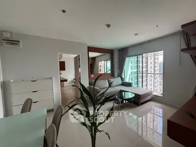 Modern living room with city view and stylish furniture