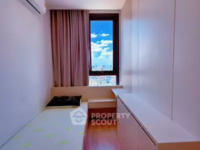 Cozy bedroom with city view, featuring minimalist design and natural light.