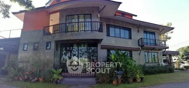 Stunning modern house with large windows and lush garden, perfect for family living.