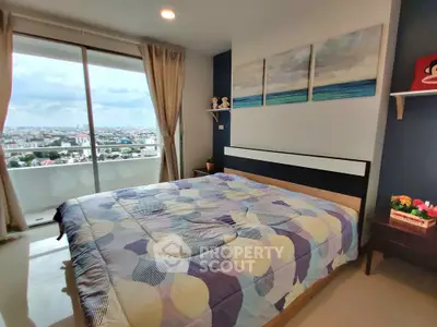 Spacious bedroom with stunning city view and modern decor
