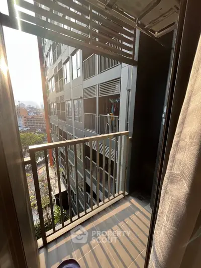 Modern apartment balcony with city view and sleek railing design