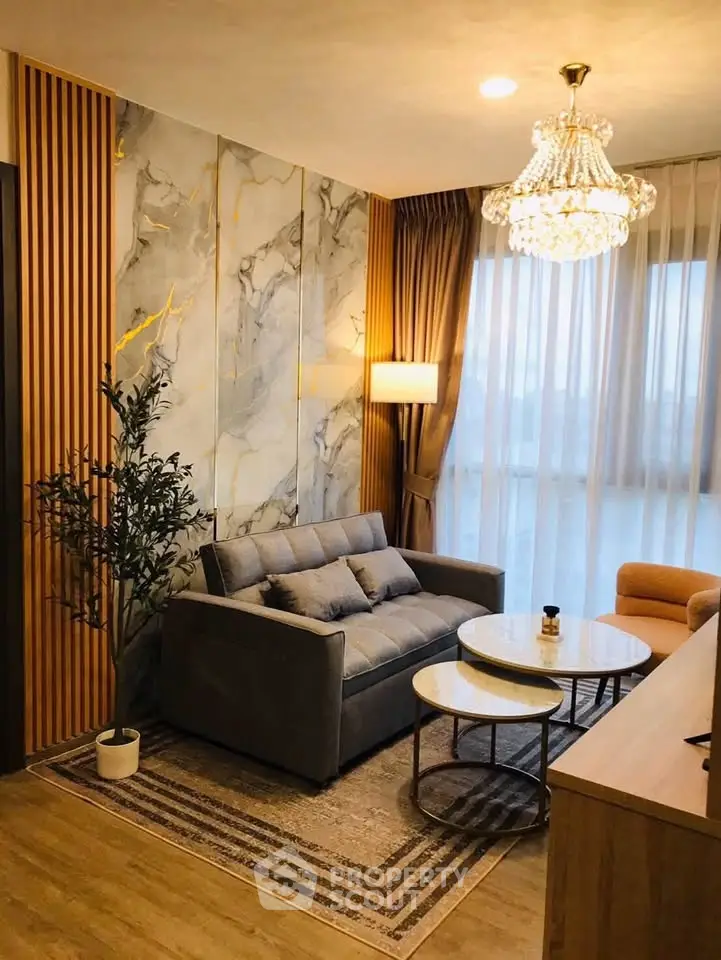Luxurious living room with elegant chandelier and modern decor