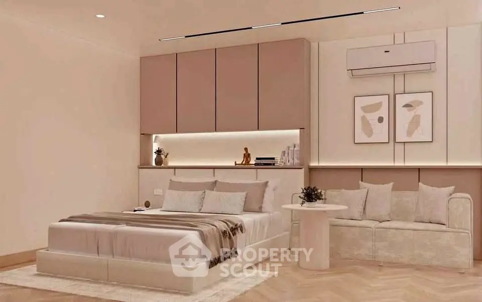 Luxurious bedroom with modern decor and cozy seating area