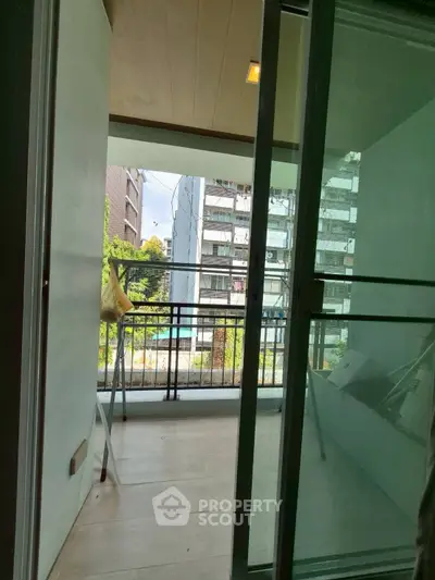 Spacious balcony with city view, perfect for relaxation and enjoying the outdoors.