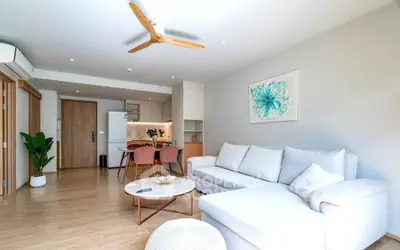 Modern living room with stylish decor and open kitchen layout