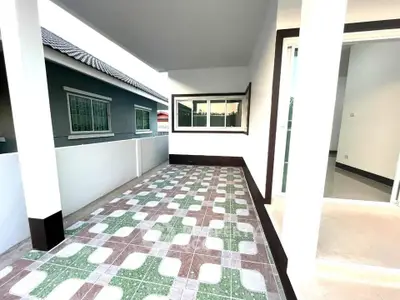 Spacious tiled balcony with modern design and ample natural light
