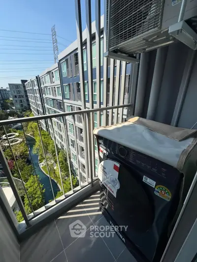 Modern balcony with washing machine and scenic view of residential complex