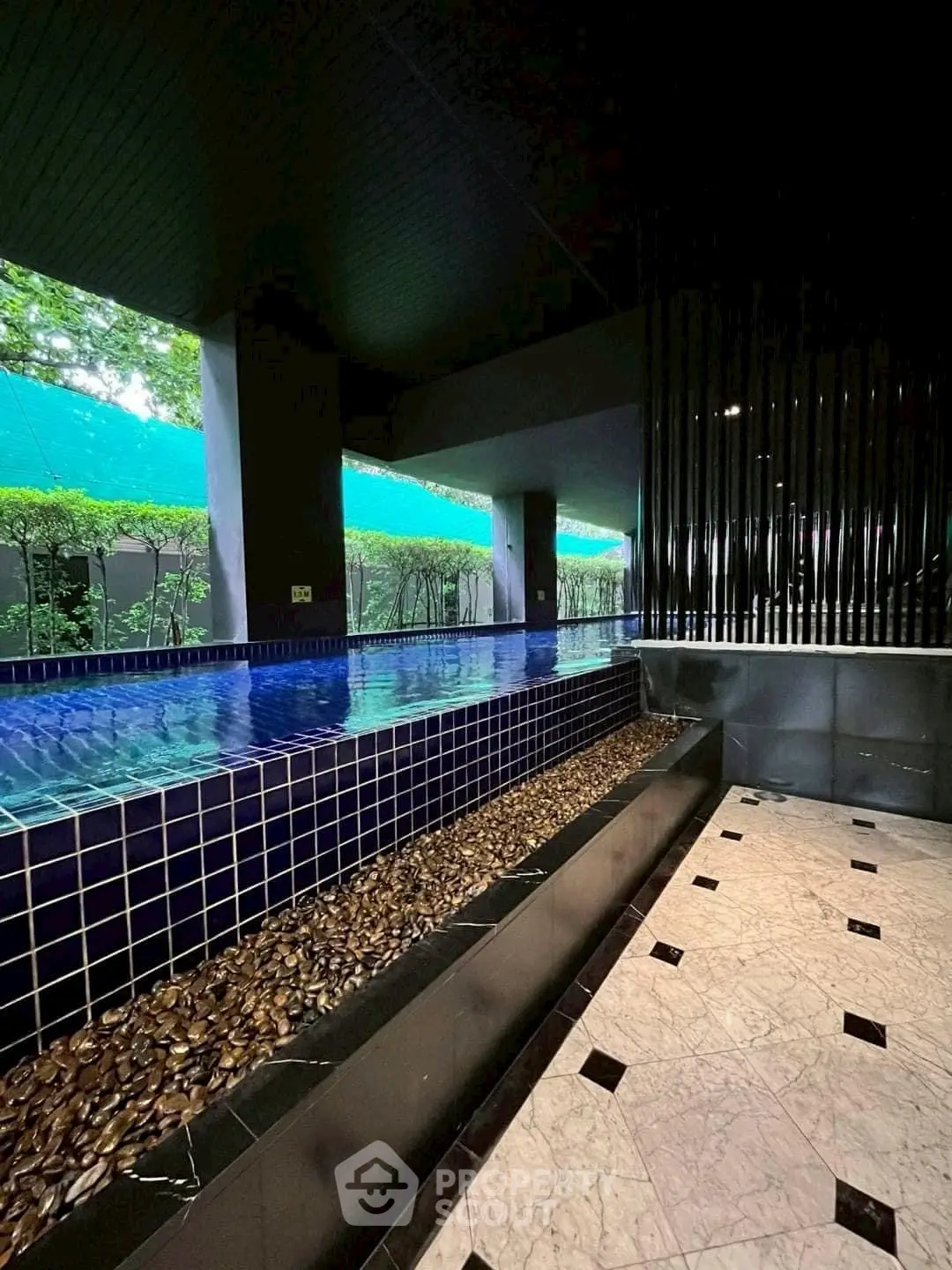 Luxurious indoor pool area with modern design and elegant finishes.