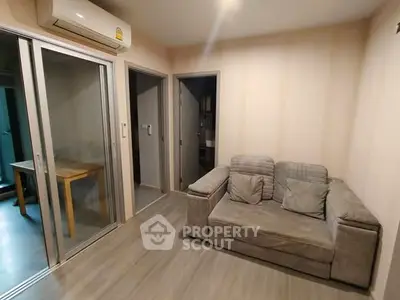 Cozy living room with modern sofa and sliding glass doors