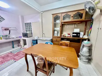 Cozy kitchen with wooden dining table and ample storage space