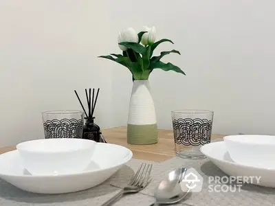 Elegant dining setup with modern decor and stylish tableware