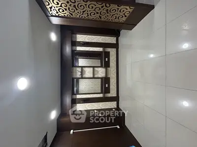 Elegant modern interior with decorative wooden paneling and glossy tiled flooring