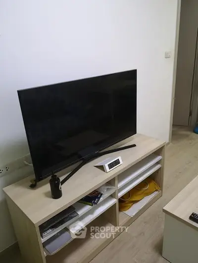Modern living room with sleek TV and stylish wooden cabinet