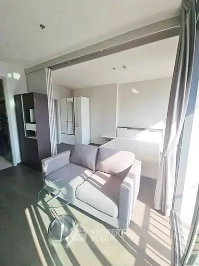 Modern living room with sleek furniture and abundant natural light