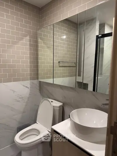 Modern bathroom with elegant tile design and sleek fixtures