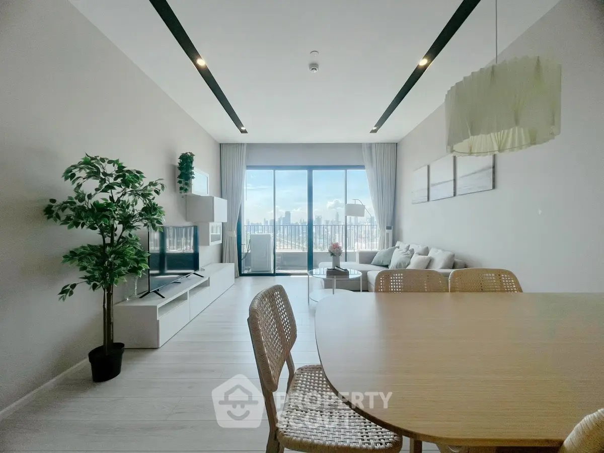Spacious modern living room with city view and elegant decor