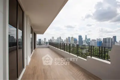 Spacious balcony with stunning city skyline view, perfect for urban living.
