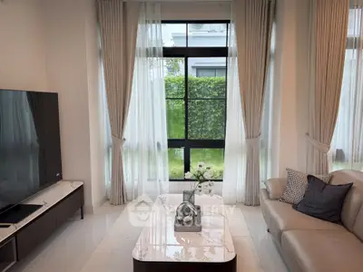 Elegant modern living room with large windows and stylish decor