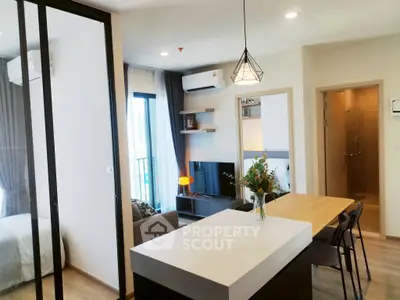 Modern open-plan living room with kitchen island and stylish decor