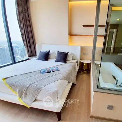 Luxurious bedroom with city view and modern bathtub, perfect for urban living.