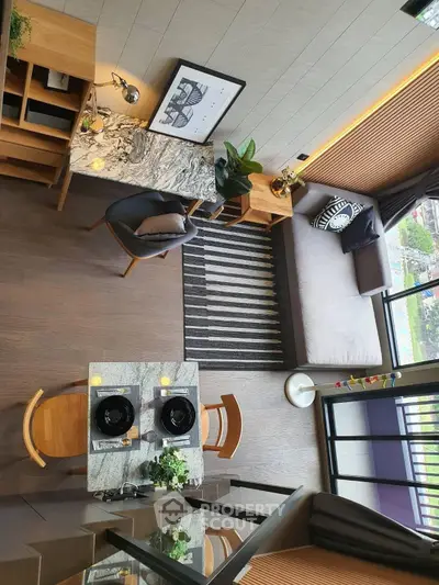 Modern living room with stylish decor, open layout, and balcony view in a contemporary apartment.