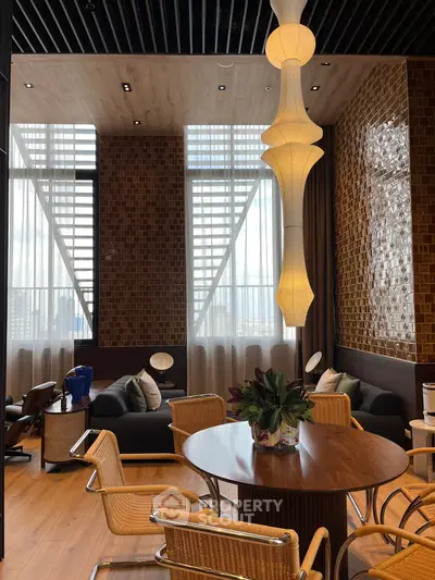Luxurious modern living room with elegant lighting and stylish furniture, perfect for sophisticated urban living.