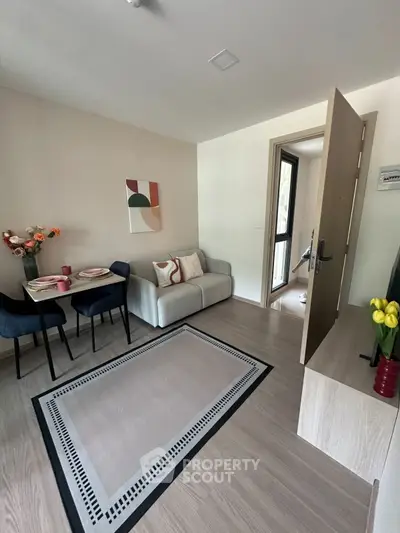 Charming small living room with modern decor and cozy dining area, perfect for urban living.