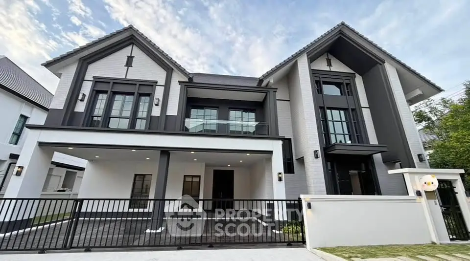 Stunning modern two-story house with sleek design and spacious driveway