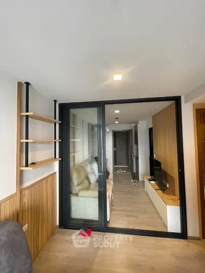 Modern living room with sliding glass doors and stylish shelving