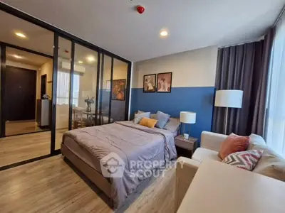 Modern bedroom with glass partition and cozy decor in stylish apartment