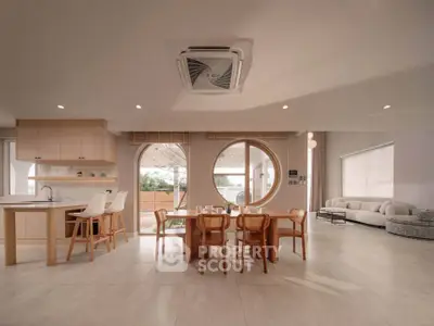 Spacious modern living room with open kitchen and stylish furniture