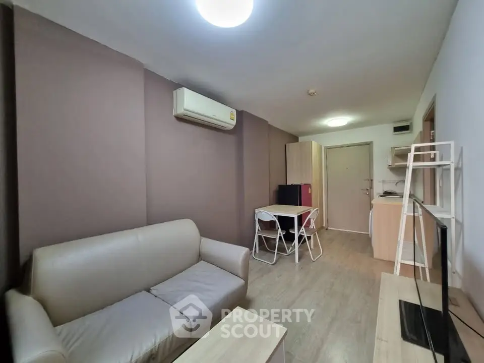 Cozy living room with modern furniture and air conditioning in a stylish apartment.