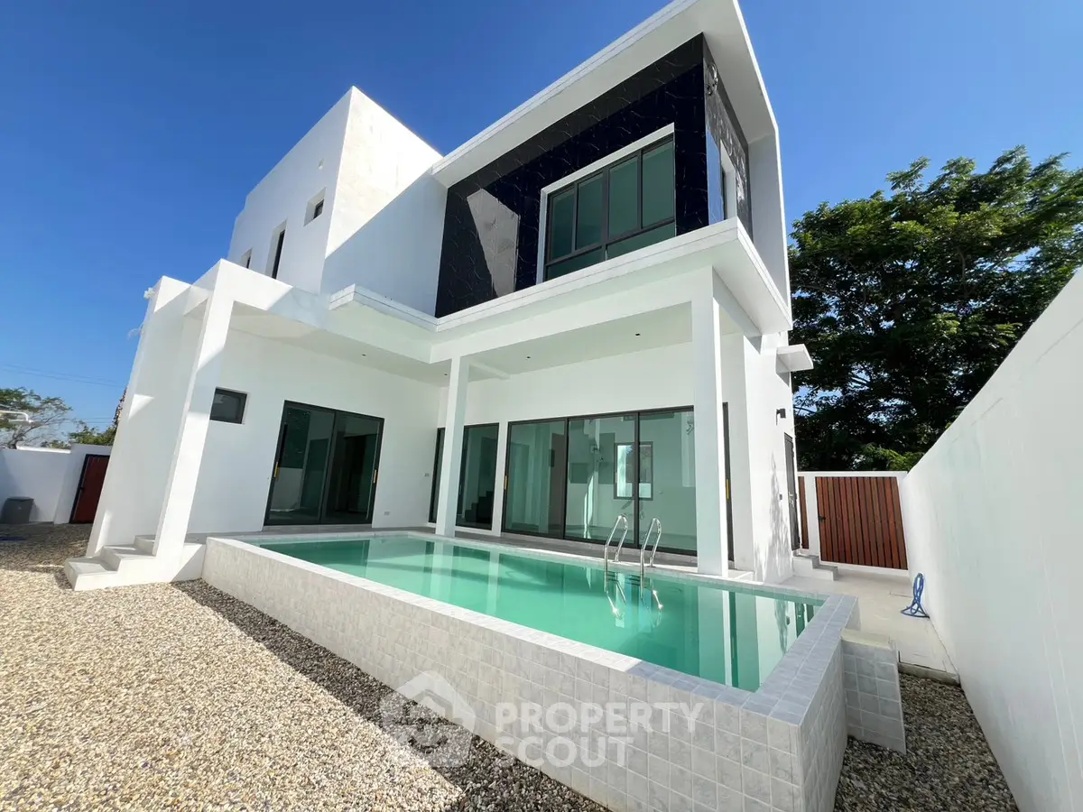 Modern luxury villa with private pool and sleek architectural design.